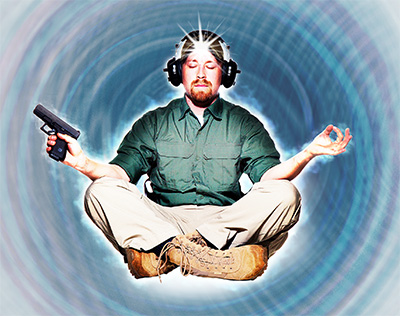 man sitting with handgun