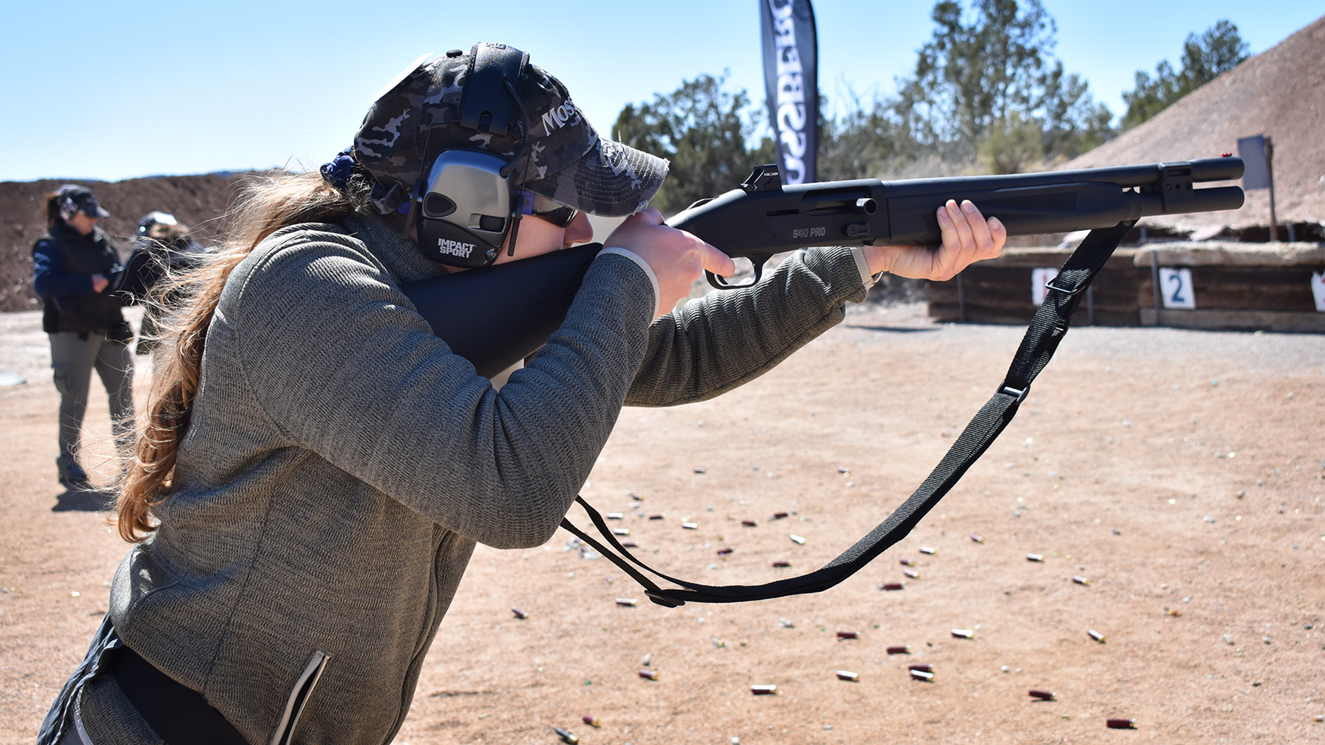 Person shooting shotgun on range at Gunsite Academy