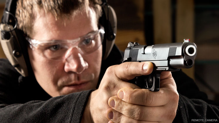 Holding a pistol