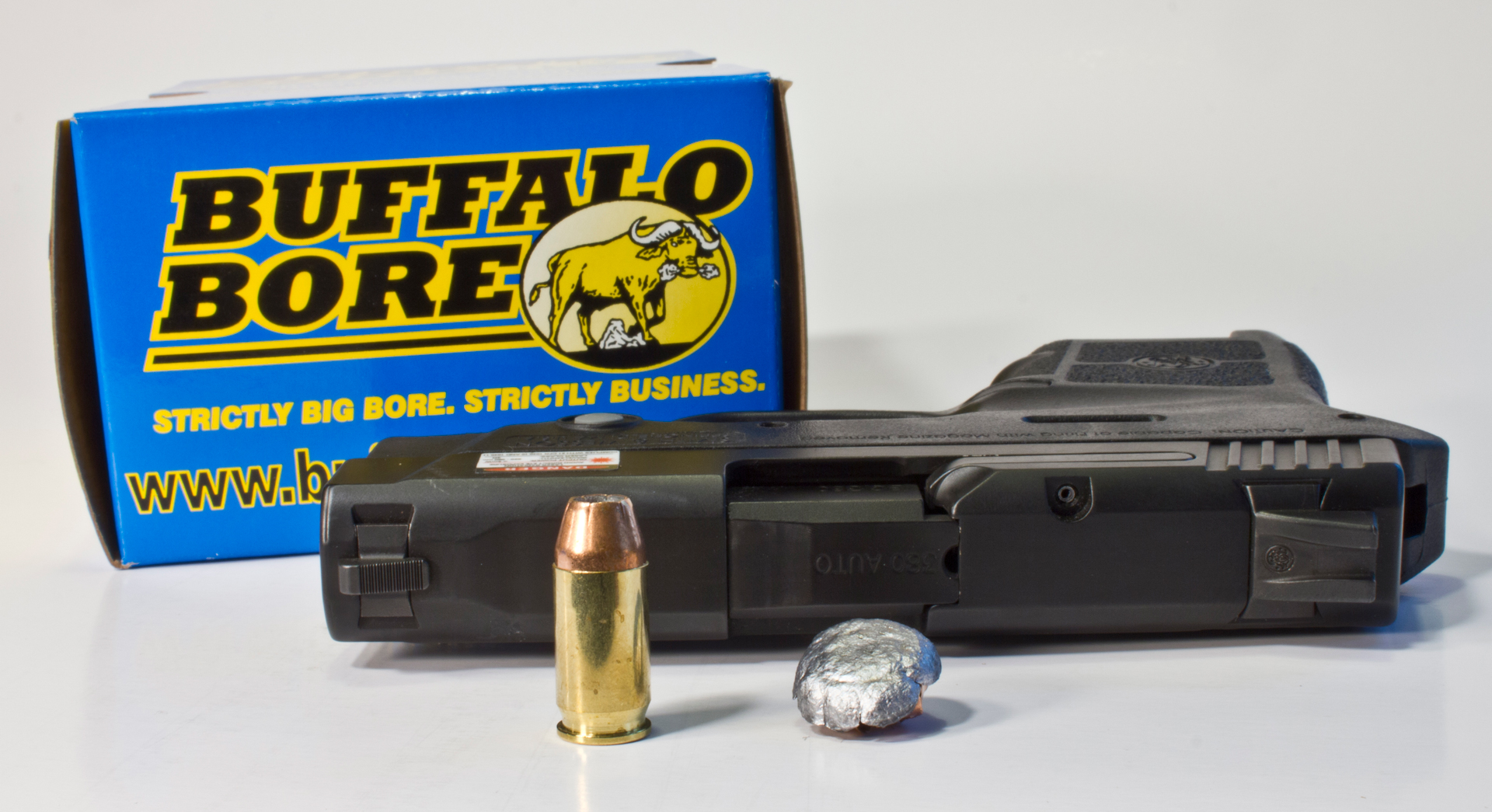 handgun next to bullet and recovered slug